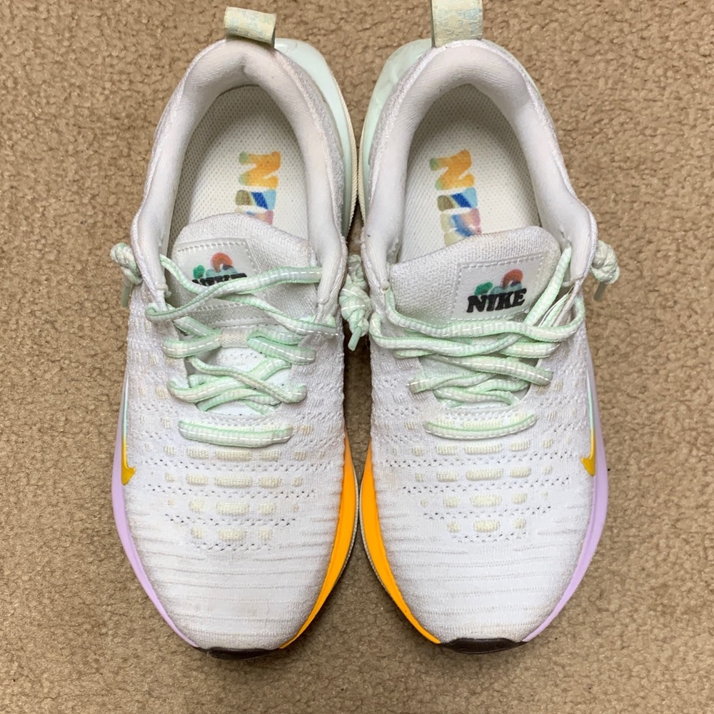 Nike women’s White, Yellow, and Purple Sneakers